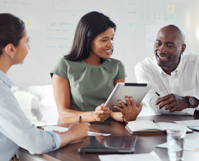 Group of Advisors Looking at Tablet Financial Data