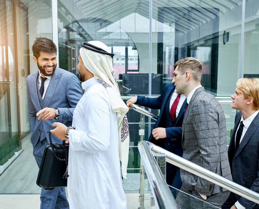 Group Of Diverse Business People Walking Into Building