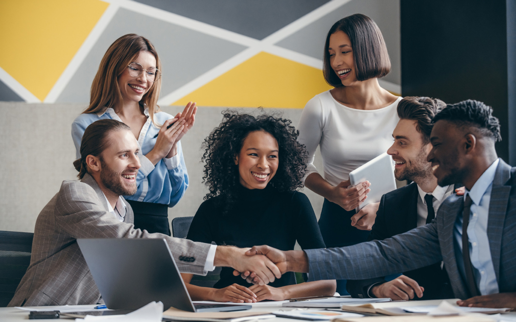 Investor Shaking Hands With Business People